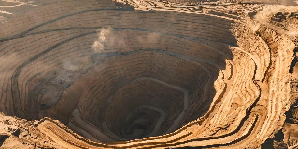 Panoramic view of a huge open-pit mine for copper extraction. Stock Photos