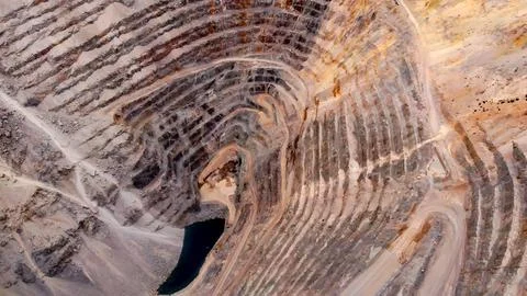 Panoramic view of a huge open-pit mine for copper extraction Stock Photos