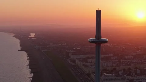 Panoramic View of i360 Tower in Brighton UK During Sunset with Orange Sky Stock Footage 315496517
