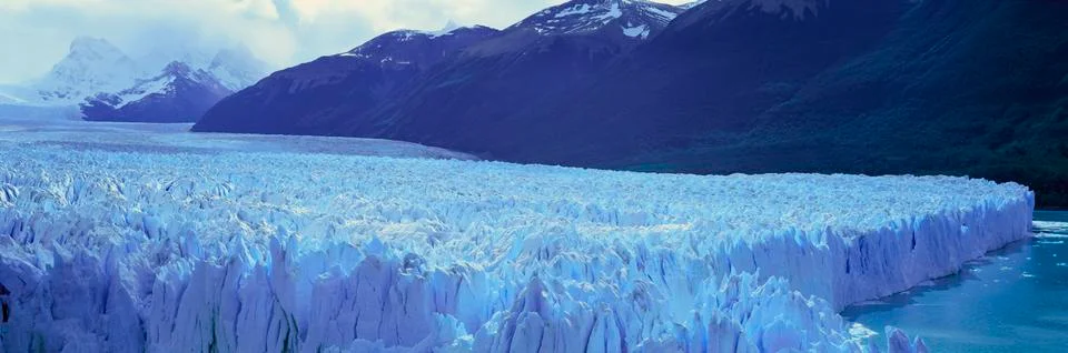 Panoramic view of icy formations of Perito Moreno Glacier at Canal de Tempanos Stock Photos