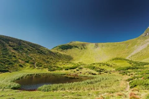 Panoramic view of idyllic mountain scenery Stock Photos