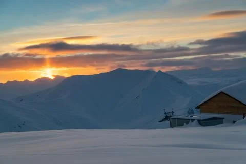Panoramic view of idyllic winter mountain tops and mountain huts in the Caucasus Stock Photos