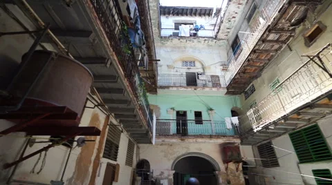 Panoramic view interior of old ragged cuban courtyard with poor houses in Havana Stock Footage 67865719