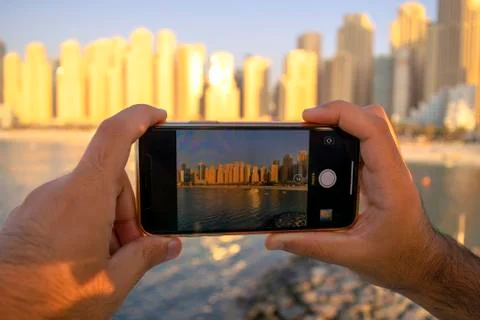 Panoramic view of JBR through mobile camera. Man taking photo of beach Stock Photos