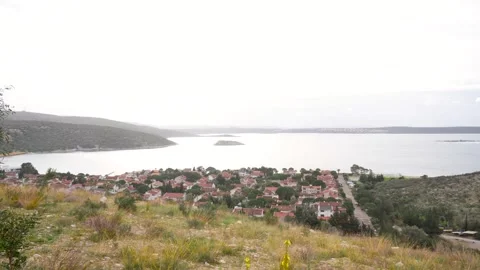 Panoramic View of Karaburun Coastline and Seaside Village with Aegean Sea Pan Stock Footage 328246740