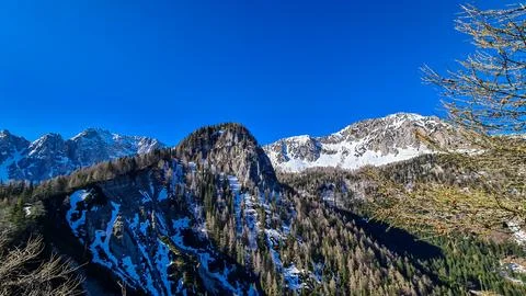 Panoramic view of Karawanks mountain range on sunny day in Carinthia, Austr.. Stock Photos