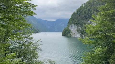 Panoramic view of Konigssee Lake. Motion of water, boats. Bavaria, Germany 動画素材 333584209
