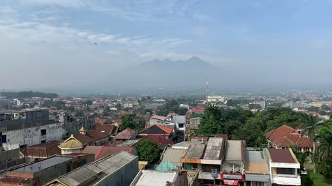 Panoramic view of Kota Bogor, Java, Indonesia and Mount Salak Stockbeeldmateriaal 105308861