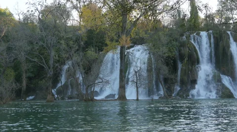 Panoramic view of Kravice waterfall and the river flowing Stock Footage 60382731