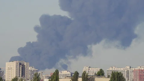 Panoramic view of Kyiv skyline with heavy black smoke after air attacks Video stock 344010946