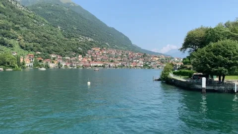 Panoramic view of Lago di Como. Ferry arrives at Comacina island, Como Lake Stock Footage 162579885