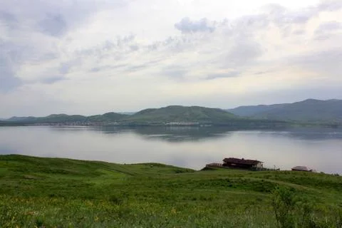 Panoramic view. A lagoon with a clean mountain lake in the midst of majestic Fotos Stock
