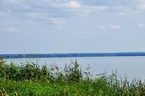 Panoramic view of the lake. Cloudy summer day. Stock Photos