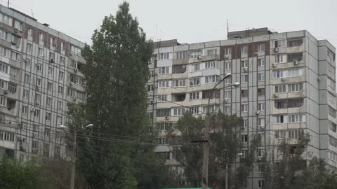 Panoramic view of a large gray Soviet building. The building of the USSR against 動画素材 219598603