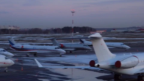 Panoramic view of a large number of aircraft parked at the airport. 4K footage Stock Footage 105702013