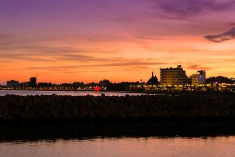 Panoramic view of Larnaca skyline at sunset, seen from the Main Harbour. Stock Photos