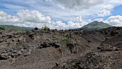 Panoramic View of Lava Valley with Mount Batur and Clouds on Bali Stock Footage 339983006
