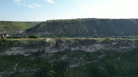 Panoramic view of layered cliffs and lush vegetation Stock Footage 340240281