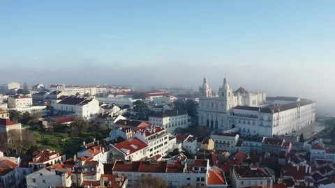 Panoramic view of Lisbon; old yellow rooftops in Portuguese capital Stock Footage 105294560