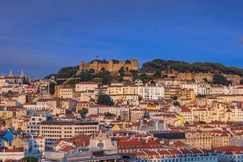 Panoramic view of Lisbon's densely packed colorful buildings and the iconic S Stock Photos