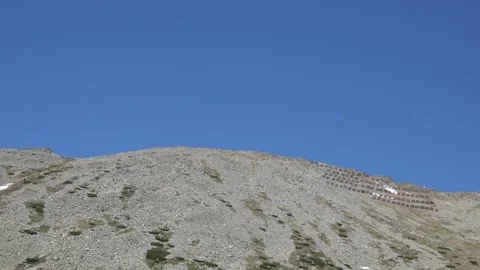 Panoramic view of Lomnicky saddle and peak from the Skalnate lake Stock Footage 202994432