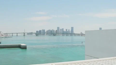 Panoramic view from Louvre Abu Dhabi museum to city skyline and The Sheikh .. Stock Footage 308646064