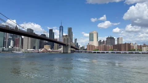 Panoramic view of Lower Manhattan skyline and Brooklyn Bridge. New York City Stock Footage 337837627