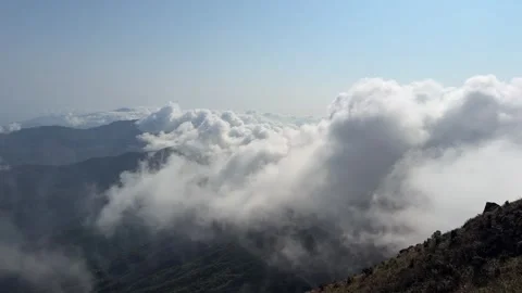 Panoramic View of Lush Green Mountains and Rolling Clouds China Stock Footage 338311697