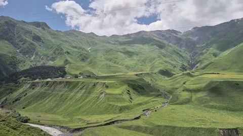 Panoramic View of Lush Green Mountains and Valley Stock Footage 342265415