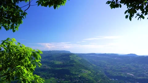 Panoramic view of lush green summer mountains under a clear blue sky Stock Footage 341997181