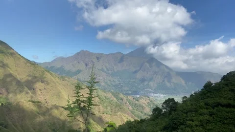 Panoramic View of Lush Tropical Mountains and Valley Under Blue Sky Video stock 340216534