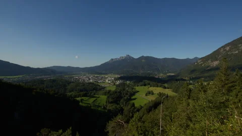 Panoramic view of a lush valley with mountains in the background under a cl.. Stock Footage 273276564