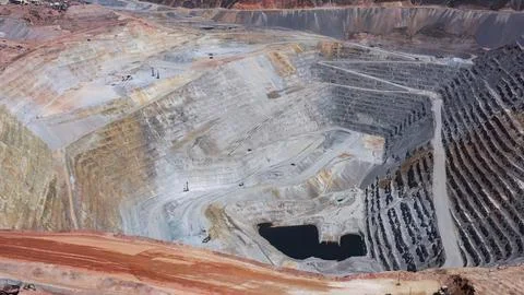 Panoramic view of the main pit of an open pit mine Stock Photos