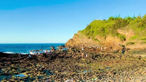 Panoramic view of majestic Mong Rong rock beach under bright morning sun Stock Footage 325094128