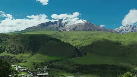 Panoramic View of Majestic Snow-Capped Mount Genyen and Green Valleys Sichuan 库存影片 339161552