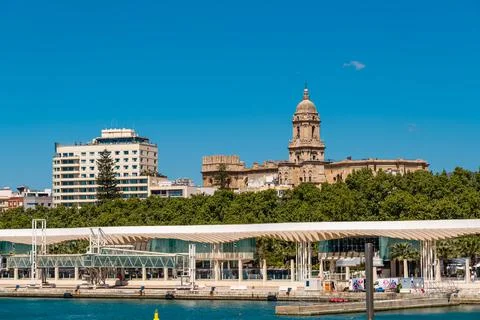 Panoramic view of Malaga city with the harbour area of "Muelle Uno". Stock Photos
