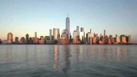 Panoramic view of Manhattan at sunset with reflections in the Hudson River. Stock Footage 149446702