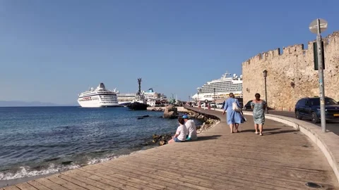 Panoramic View with a Medieval Fortress, a Ship and People on the Beach Stock Footage 340575889