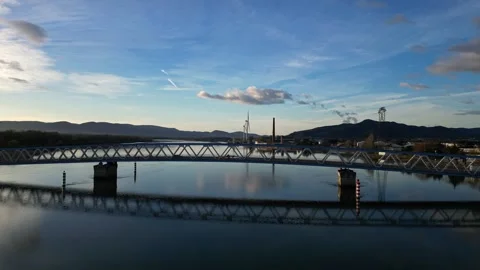 Panoramic view of a metal bridge over the Rhone river Stock Footage 248075406
