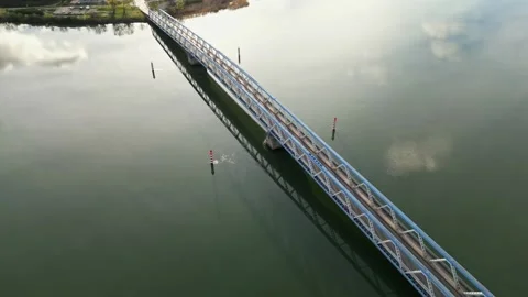 Panoramic view of a metal bridge over the Rhone river Stock Footage 248075895