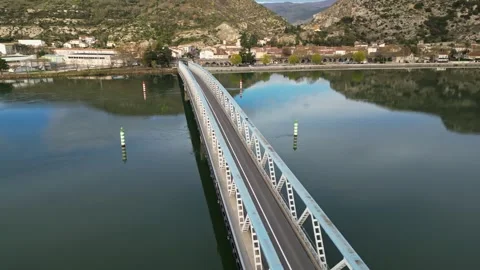 Panoramic view of a metal bridge over the Rhone river Stock Footage 248076276