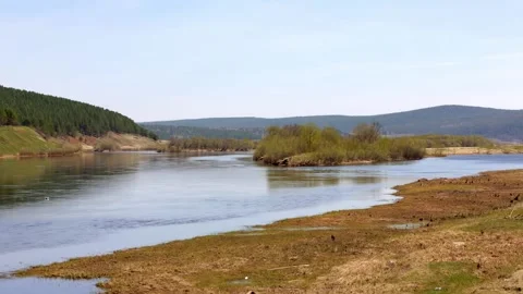Panoramic view of the middle-size river surrounded by mountains and forest. Video stock 158088176