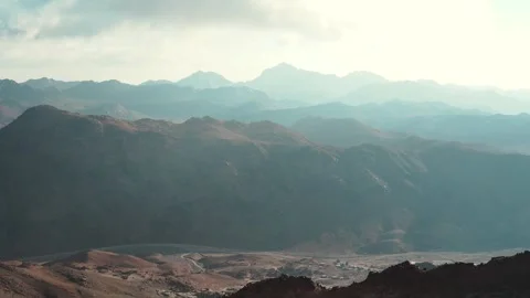 A panoramic view of a misty forest valley reveals majestic of Mousa mountain  Stock Footage 329236186