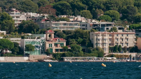 Panoramic view of modern villas and luxury hotels by the sea in Cannes, France Stock Footage 320466352