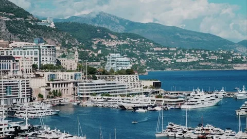 Panoramic view of Monaco's harbor filled with luxury yachts and apartments .. Video stock 339470519