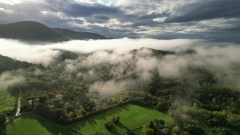 Panoramic view of the morning thick wavy fog hanging over the forest at sunrise Stock Footage 291934866
