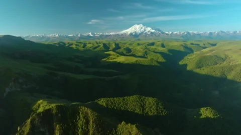 Panoramic View of Mount Elbrus and Green Mountain Landscape in Prielbrusye Natio Stock Footage 325812938