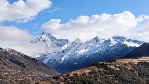 Panoramic view of Mount Siguniang or four sisters mountain featuring the four Stock Photos