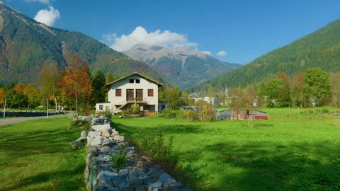 Panoramic View of Mountain Farm with Paddock, Fields, and Valley Stock Footage 320207145
