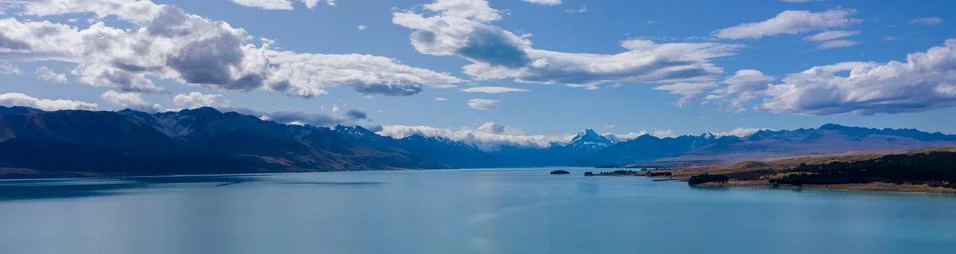 Panoramic view of mountain range and lake Stock Photos